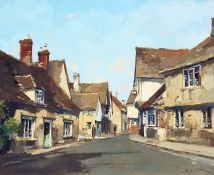 Stanley Orchart  Oil on board  "Evening Light at Lacock", signed lower right, bears label verso,