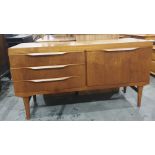 20th century teak sideboard with three drawers to the left and teak fall-door to the right, 134cm