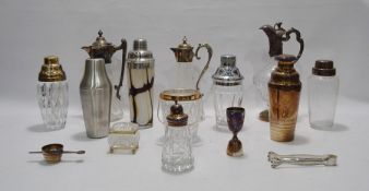 Three various EPNS-mounted glass claret jugs with variously embossed or engraved mounts, glass