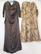 1940's vintage satin printed full-length dress and a 1940's silk day dress with ruched sleeves at