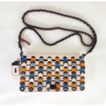 Coach cross-body turn-lock bag with patterned front flap, blue, cream, ochre, turquoise and orange