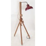 Modern floor-standing light with red shade, the body as modern beech artist's easel