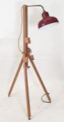 Modern floor-standing light with red shade, the body as modern beech artist's easel