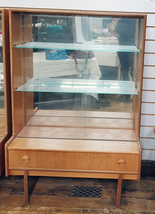 Pair of 20th century Turnidge teak lounge display cabinets, the two sliding glass doors enclosing