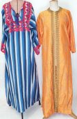 Orange embroidered silk kaftan, another peasant-style kaftan with plaited ties and bead
