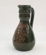 Green ground Elton jug with foliate decoration to body