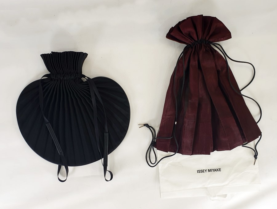 Issy Miyake pleat circular draw-string bag with leather trim and Issy Miyake pleat bag, black