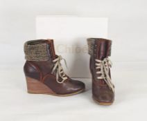 Chloe leather wedge-heeled and knitted walking boots with studs and lace fastening, in original box,