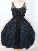 1950's pom-pom dress in black net with spot detail, net bodice over satin, brown velvet detail to