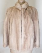 Blonde mink short jacket with mandarin collar and puff sleeves