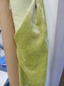 Two good lengths of lime green velvet furnishing material on two rolls