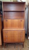 20th century teak lounge unit by Turnidge with open shelves above a secretaire fall base of three