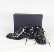 Prada brogues in black leather with white leather trim detail, size 37, in original box  Condition