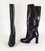 Pair of black leather Todd knee-high boots with stack heels, pimple rubber platform soles, barely