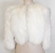 Cream fur short jacket and a faux-fur white cape (2)