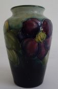 Moorcroft pottery vase, shouldered and tapering, blue/green ground painted and tube-lined with