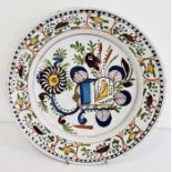 Old continental maiolica charger with stylised floral and birdcage design in aubergine, yellow