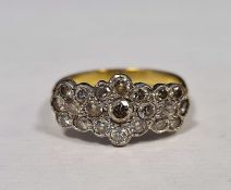 Gold-coloured metal and diamond cluster ring in the form of one large and two smaller flowerheads,
