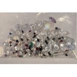 Bag of loose mixed stones including cubic zirconia, ruby, amethyst, sapphire and other gemstones,