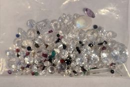 Bag of loose mixed stones including cubic zirconia, ruby, amethyst, sapphire and other gemstones,