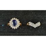 Gold-coloured metal, blue and white stone cluster ring set oval sapphire-coloured stone surrounded