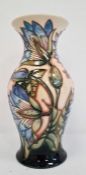 Moorcroft vase, baluster shape, cream ground with blue flowers with green leaves, limited edition