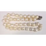 Freshwater pearl necklace with large ribbed circular beads and silver clasp and a quantity of