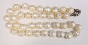 Freshwater pearl necklace with large ribbed circular beads and silver clasp and a quantity of