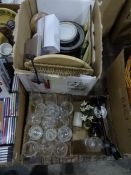 Four boxes of assorted china, glass and homewares to include wine glasses, candlesticks, plates,