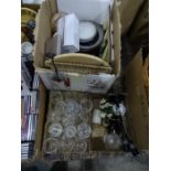 Four boxes of assorted china, glass and homewares to include wine glasses, candlesticks, plates,