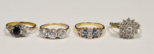 9ct gold, blue and white stone dress ring set oval stone, possibly sapphire, flanked by two very