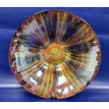 Large modern glass bowl decorated with a pink ground and browns and gold stripes, the reverse with