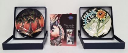 Moorcroft pottery pin tray, slip trail decoration of palm trees, 12cm diameter, boxed and another