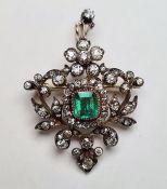 Late 19th/early 20th century gold-coloured and white metal emerald and diamond pendant/brooch, the