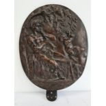 19th century bronze relief plaque of a satyr playing an instrument with a cherub beside him, oval,