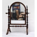 Possibly late 19th/early 20th century small toilet mirror with arch top, strung frame, spindle