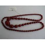 String of red amber-coloured graduated oval beads, the weight is 49.2gCondition Reportweight 49.2