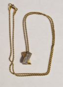 14K gold and diamond pendant, X-shape and set two rows of small diamonds and the 14K gold fine chain