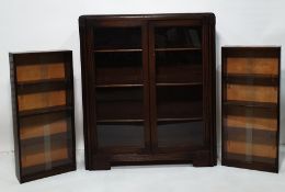 Early 20th century oak cabinet with glazed doors, chamfered corners and two further cabinets with