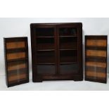 Early 20th century oak cabinet with glazed doors, chamfered corners and two further cabinets with