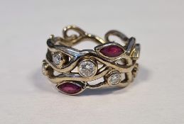 18ct white gold ruby and diamond band ring, maker’s mark GAC, London, of sinuous pierced design,