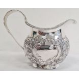 George IV silver milk jug, having gadrooned everted rim, ornate floral cornucopia decorated