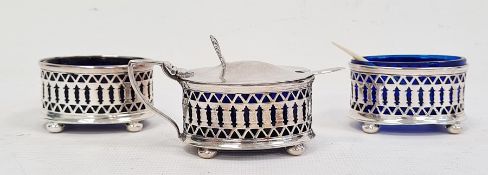 Silver three-piece condiment set viz:- oval salt, pepper and covered mustard, each with pierced