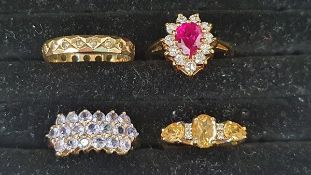 9ct gold, pink and white stone dress ring set central pear-shaped pink stone surrounded by border of