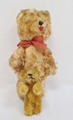 Miniature gold plush bear in the manner of Schuco and one further (2)