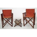 Two folding directors chairs and a folding magazine rack