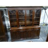 20th century mahogany dresser with four astragal-glazed doors enclosing shelves, above four