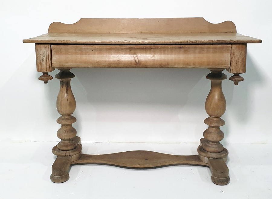 Pine wash stand with galleried back above single cushion drawer, on baluster turned end supports and
