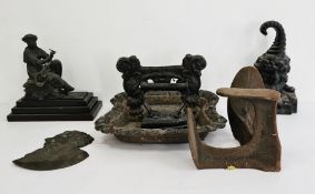 19th century black wrought iron boot and shoe scraper, a wrought iron weighted doorstop, a spelter