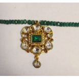 Polychrome enamel green, white and pink stone pendant with green hardstone bead necklace Condition